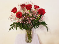 Half Dozen Red Roses and Pink Baby's Breath in Clear Vase