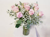 Dozen Pink Roses Arrangement in Clear Vase