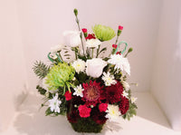 Christmas Seasonal Arrangement in Preserved Moss Basket