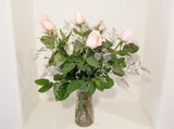 Dozen Pink Roses Arrangement in Clear Vase