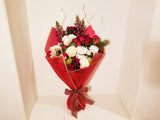 This winter fresh seasonal bouquet of timeless ivory roses, breathtaking white roses, white Snapdragon, Carnations, Mums, and seasonal greens and more is sure to wow your lucky loved one.