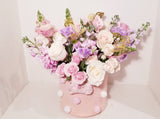 Bucket of Love - Imagine this gorgeous flower arrangement getting delivered to your door... dreamy! Pink, lavender and creamy flowers such as roses, spray roses, stocks tulips, snapdragons chrysanthemum sophistically arranged with lush greenery and fillers. (Flower: Flowers/Hatbox Color and variety may vary) 