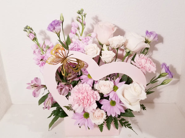 Celebrate your love phase with the Young Love Arrangement, which has a stunning mix of lavender, creamy and pink flowers such as roses, spray roses, stocks, snapdragons, Mums sophistically arranged with lush greenery and fillers. The perfect romantic gift to send to the one who's always on your mind and in your heart!