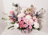 Adorable Valentine basket arrangement, which has a stunning mix of pink, peach, creamy and lavender seasonal flowers such as roses, spray roses, stocks, Mums ...etc,  sophistically arranged with lush greenery and fillers. 