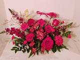 Valentine basket arrangement, which has a stunning mix of roses, spray roses, fancy carnation, spray carnations, Alstroemerias, sophistically arranged with lush greenery and fillers.  