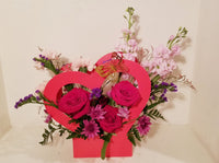 Be My Valentine - Unique flower arrangement with red Roses, carnations, stocks, other valentine seasonal flowers and greenery. Send this arrangement your very special person with the message of "Be my valentine? " 