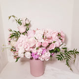 Angelynn II - Soft and delicate, Angelynn is designed with gorgeous Hydrangeas, fragrant Roses, Alstroemerias, Daisy and a mix of beautiful textures arrangement