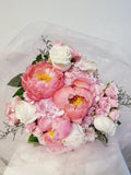 Signature Mother's Day Bouquet - Stunning bouquet of peonies, roses, hydrangeas, filler and greenery wrapped with soft pink tulle fabric.