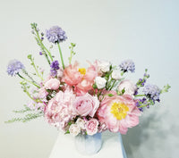 Best Mom Ever Arrangement - Imagine these gorgeous flowers arrangement getting delivered to your door... dreamy! Pink, lavender and creamy flowers such as Peonies, roses, spray roses, stocks Scabiosa sophistically arranged with lush greenery and fillers.