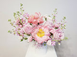 A Mother’s Love Arrangement - A mother’s love is a kind of love no one else will ever supply. Spoil mom with this arrangement of pink, peachy, and creamy flowers like Peonies, roses, spray roses, and stocks.