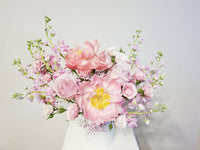 A Mother’s Love Arrangement - A mother’s love is a kind of love no one else will ever supply. Spoil mom with this arrangement of pink, peachy, and creamy flowers like Peonies, roses, spray roses, and stocks.