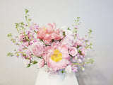 A Mother’s Love Arrangement - A mother’s love is a kind of love no one else will ever supply. Spoil mom with this arrangement of pink, peachy, and creamy flowers like Peonies, roses, spray roses, and stocks.