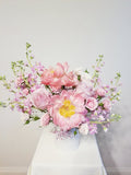 A Mother’s Love Arrangement - A mother’s love is a kind of love no one else will ever supply. Spoil mom with this arrangement of pink, peachy, and creamy flowers like Peonies, roses, spray roses, and stocks.