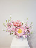 A Mother’s Love Arrangement - A mother’s love is a kind of love no one else will ever supply. Spoil mom with this arrangement of pink, peachy, and creamy flowers like Peonies, roses, spray roses, and stocks.