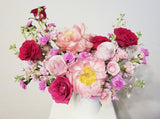 Show love to cheerful moms with a beautiful arrangement of pink, peachy, and creamy flowers like Peonies, roses, spray roses, and stocks.