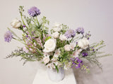 Lavender Bliss - Elegant ceramic vase with lavender Scabiosas, Alstroemeria, roses, Queen Anna Lace, filler, and lush greenery.