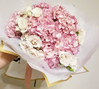 Customizable bouquet with delicate Pink Hydrangeas and White Spray Roses. Pink hydrangeas symbolize love, grace, and thoughtfulness. Perfect for special occasions and heartfelt gestures