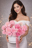 Blushing Petals Box - A breathtaking floral arrangement in the French style, showcasing a trio of romantic roses soft pink tones in gentle, sophisticated colors.