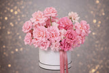 Blushing Petals Box arrangement in the French style, showcasing a trio of romantic roses in gentle, sophisticated colors
