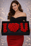 Woman holding a box of red roses shaped like 'I § U' against a glittery background