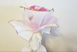 Premium 30 Mixed Fancy Carnations – Extended Vase Life Decorative flower arrangement in a white vase with pink flowers on a light background