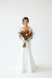 Beautiful luxury tropical wedding bouquet featuring exotic red ginger and vibrant heliconia