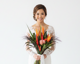 Beautiful luxury tropical wedding bouquet featuring exotic red ginger and vibrant heliconia