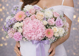 A breathtaking fusion of texture and soft color, this signature arrangement brings the timeless elegance of a Parisian garden into any space. 