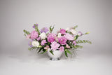 This is a sophisticated composition of Garden Roses and seasonal blooms, along with filler and greenery meticulously selected by our designers.