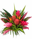 Wild Tropical Passion is a bold, exotic bouquet featuring vibrant tropical blooms and lush greenery.