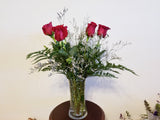 Half Dozen Roses Arrangement In Clear Vase