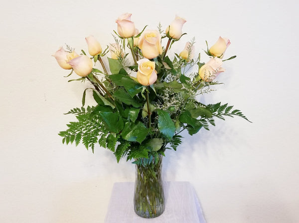 One Dozen Peach/Yellow Roses Arrangement In Clear Vase