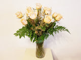 One Dozen Peach Roses Arrangement In Clear Vase