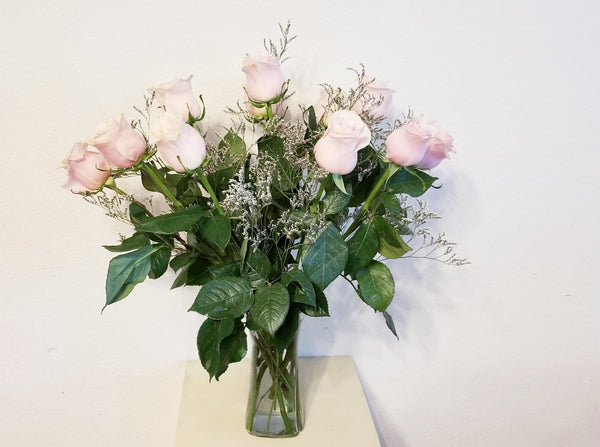 One Dozen Blush/Pink Roses Arrangement In Clear Vase