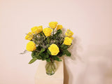 One Dozen Yellow Roses Arrangement In Clear Vase