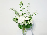 Modern and elegant, this gorgeous arrangement of Hydrangeas, White Roses, White Alstroemerias and olive branch 