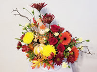 beautiful arrangement filled with roses, Chrysanthemums, and mums in the warm hues of fall