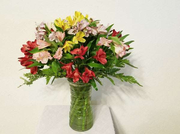 Peruvian lilies (Alstroemeria) arrangement in clear vase